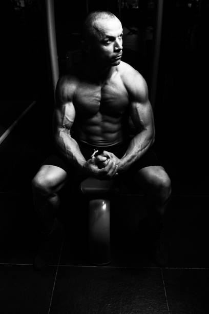 istock Attractive Young Man Resting In Gym Afther Exercise 1194573859