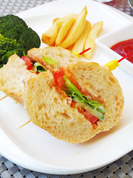 Vegetable sandwich with  french fries and ketchup