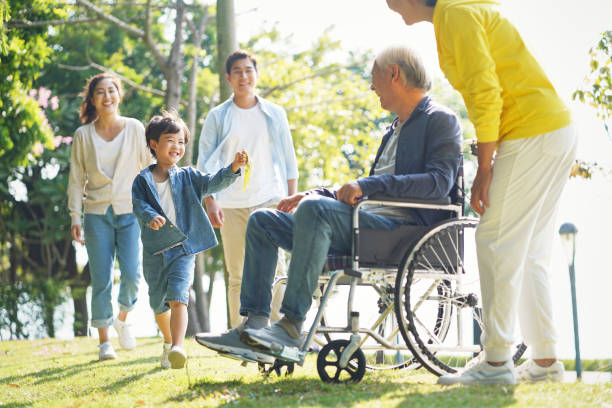 asian family having a good time outdoors young asian couple and child visiting grandparents in nursing home china chinese ethnicity smiling grandparent stock pictures, royalty-free photos & images