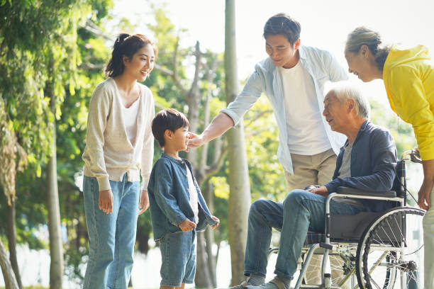 asian family having a good time outdoors happy asian three generation family having fun outdoors in park china chinese ethnicity smiling grandparent stock pictures, royalty-free photos & images