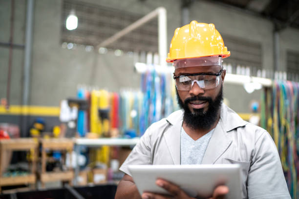 istock Man working with his digital tablet in the factory 1194579535
