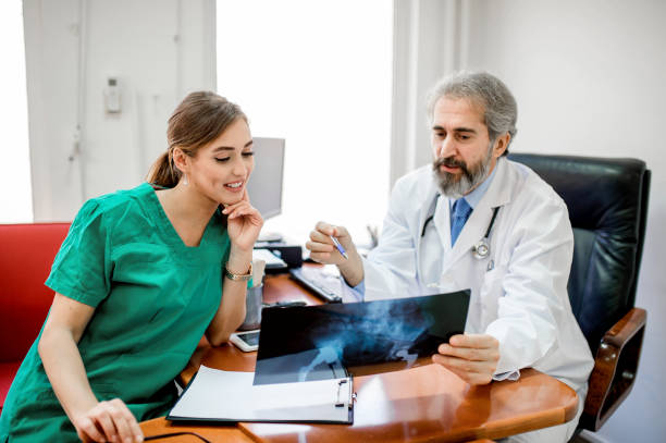 istock Medical experts cooperating while analyzing medical scan in the hospital 1194580385