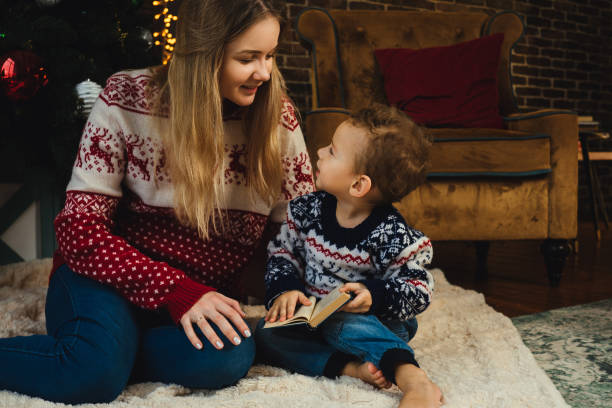 istock Mother and son in christmas sweaters. 1194580530