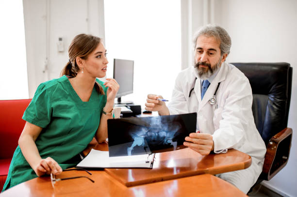 istock Medical experts cooperating while analyzing medical scan in the hospital 1194581491