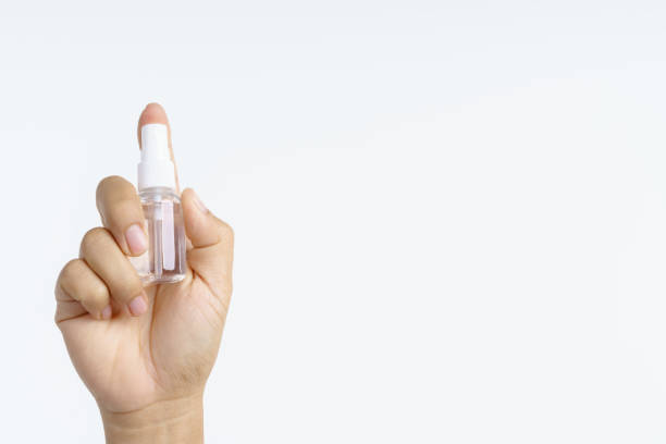 istock Hand holding plastic water spray bottle 1194583276