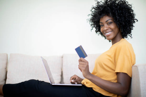 istock Young woman shopping online 1194587484