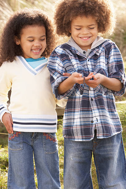 istock Children Holding Worm Outdoors 119458753