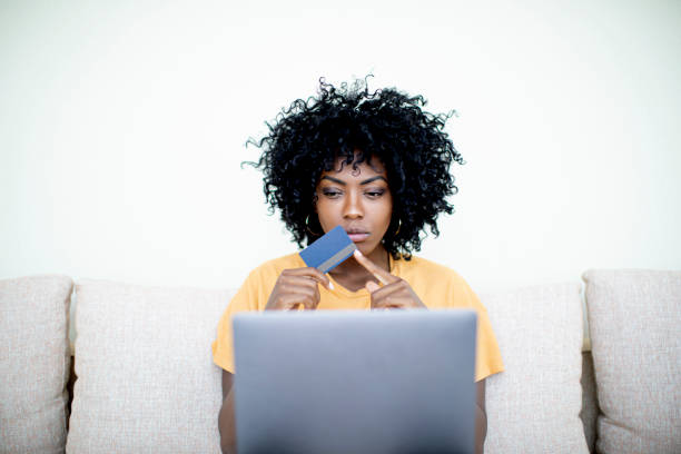 istock Young woman shopping online 1194590318