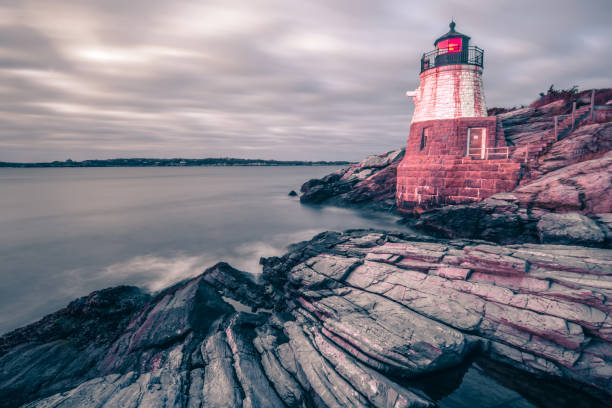 istock sunset in newport rhode island at castle hill lighthouse 1194599701