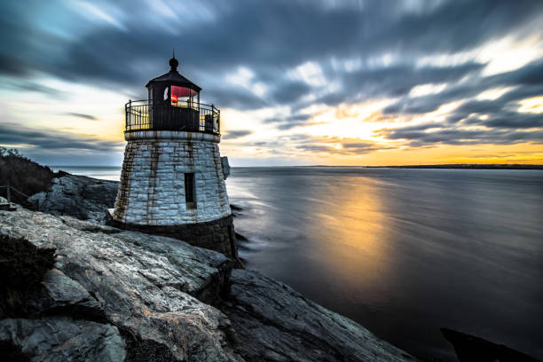 istock sunset in newport rhode island at castle hill lighthouse 1194599713
