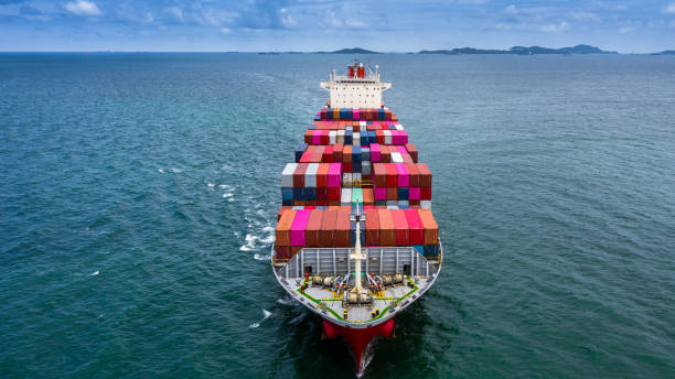 istock Container ship carrying container for business logistic freight import and export, Aerial view container ship arriving in industrail port or commercial port. 1194601075