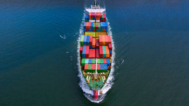 istock Aerial view container ship carrying container in import export business logistic and transportation of international by container ship in the open sea. 1194601085