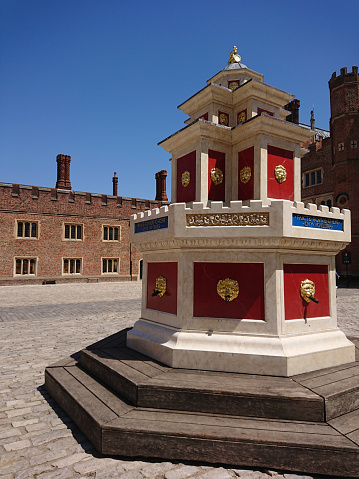 Hampton Court, London, UK - 27 June 2019: Capture the architecture and exterior design of the vintage heritage of Hampton Court Palace.