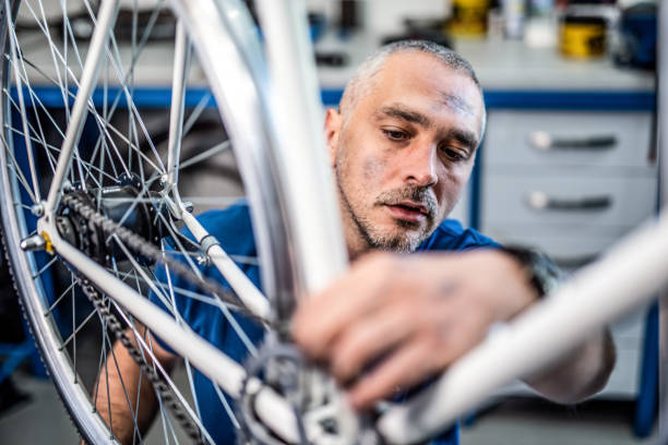 istock Bicycle technician repairing bicycle transmission. 1194603653