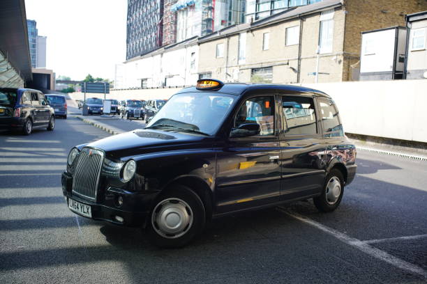 London, UK - 23 June 2019: Hackney carriages, or black cabs, the black taxi serves in the city.