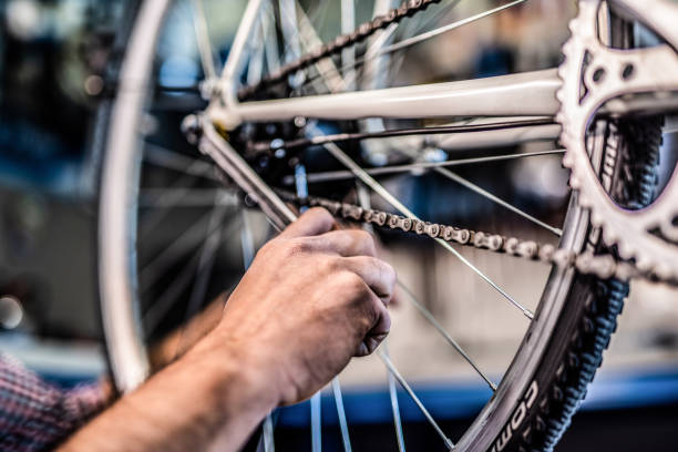 istock Bicycle technician repairing bicycle transmission. 1194604514