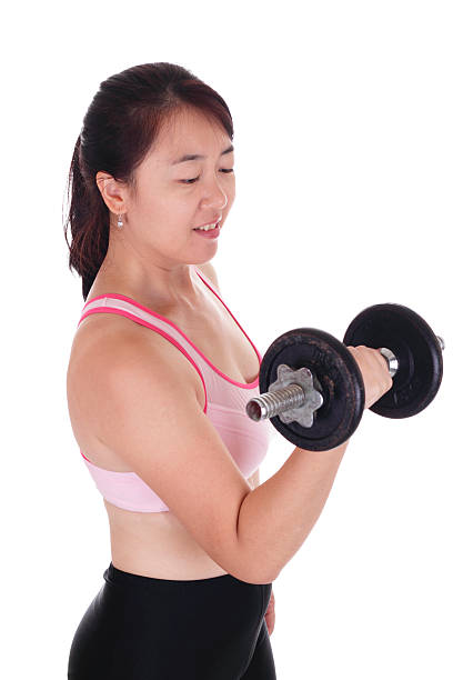 istock Woman lifting dumbbell 119460573