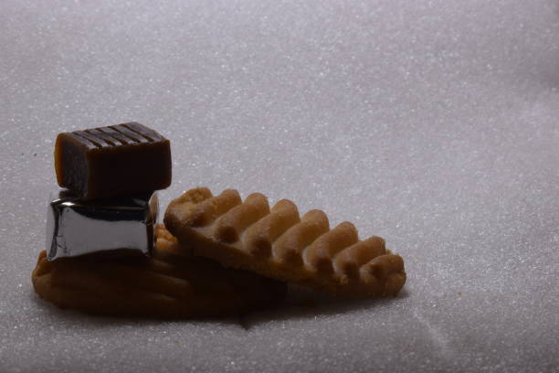 close up cookie and chocolate bar with white background