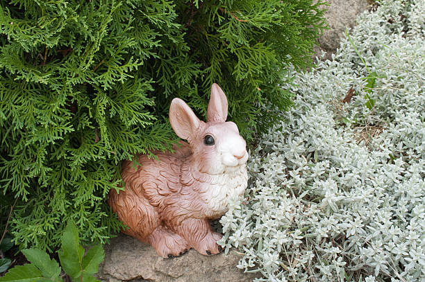 istock Green foliage and toy hare 119460802