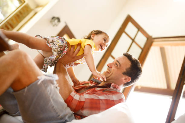 istock Father playing with his daughter 1194610809