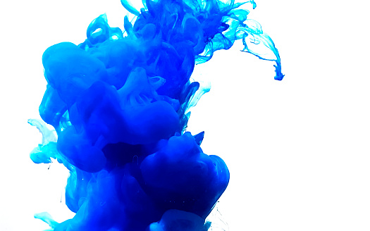 Blue fantastic abstract background. Stylish modern background. Watercolor ink in water. Powerful explosion of paints on a white background. Cool trending screensaver.