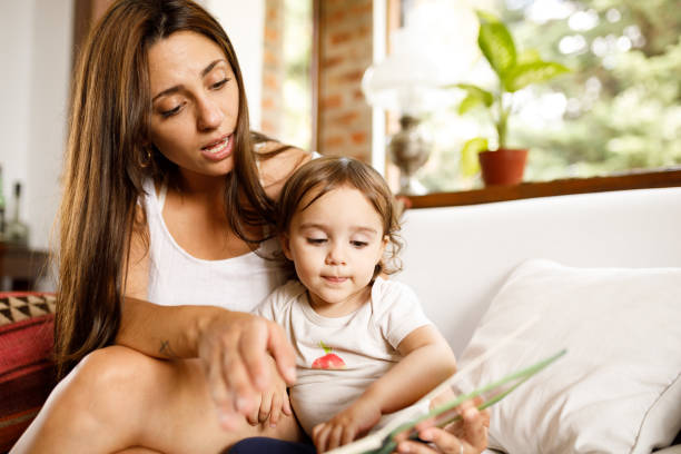 istock Mom and daughter enjoying a book 1194610834