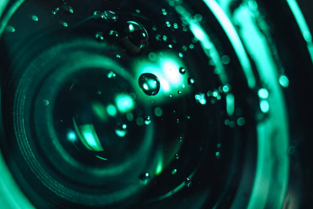 istock Close up beautiful Camera lens of drop water, aqua menthe light. Background pattern for design. Macro photography view. 1194610861