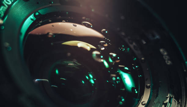 istock Close up beautiful Camera lens of drop water, aqua menthe light. Background pattern for design. Macro photography view. 1194610886