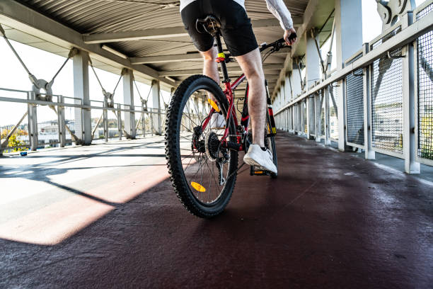 istock Young man biking in city 1194612641