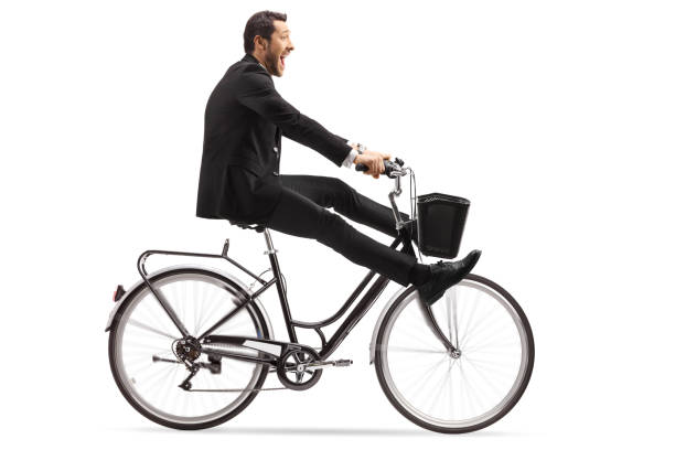 istock Crazy businessman riding a bicycle with legs up 1194626486