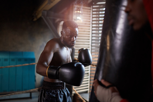 Boxer use various punch combinations, including the jab, hook, uppercut, cross, swing, straight. Getting in close to make opponent on ropes and knockout. Boxing champions win the round in boxing ring