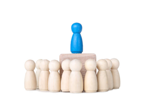 istock Leader concept. Wooden figures on white background 1194629371