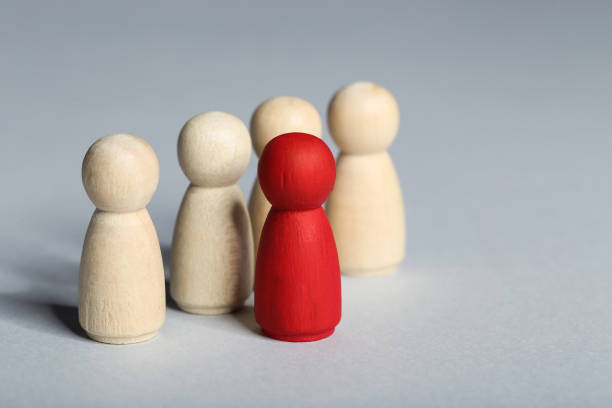 istock Leader concept. Wooden figures on gray background 1194629571
