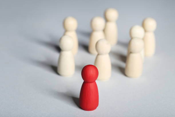 istock Leader concept. Wooden figures on gray background 1194629586