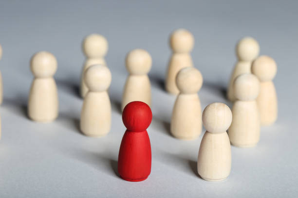 istock Leader concept. Wooden figures on gray background 1194629591