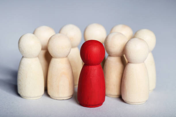 istock Leader concept. Wooden figures on gray background 1194629595