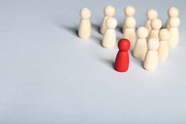 istock Leader concept. Wooden figures on gray background 1194629608