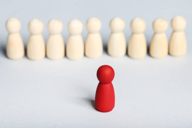 istock Leader concept. Wooden figures on gray background 1194629614