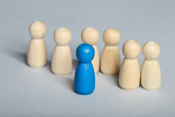 istock Leader concept. Wooden figures on gray background 1194629624