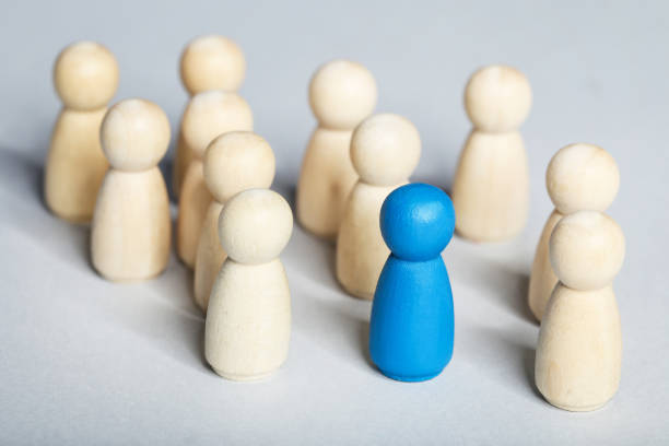 istock Leader concept. Wooden figures on gray background 1194629634