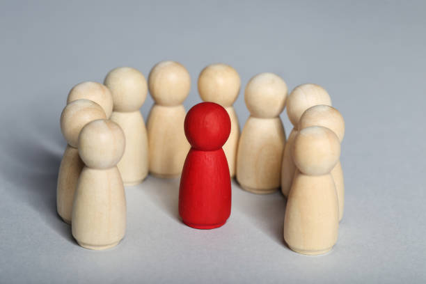 istock Leader concept. Wooden figures on gray background 1194629683