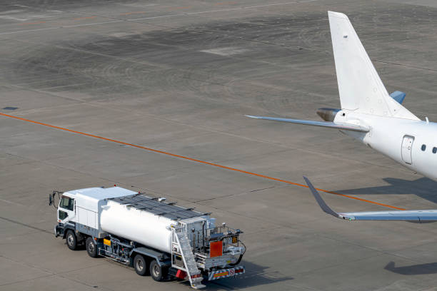 istock Passenger plane and fuel car 1194631502