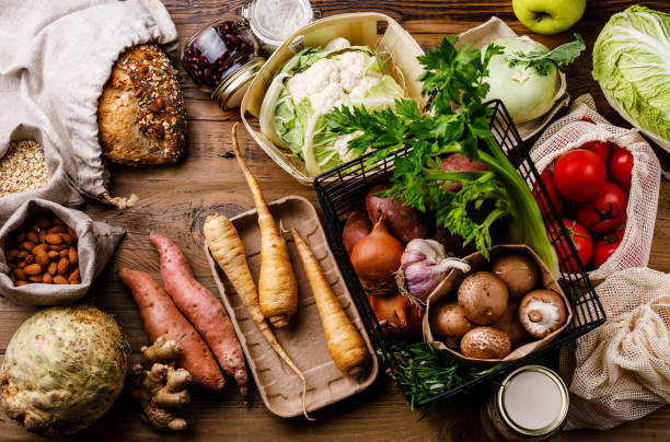 istock Healthy food vegetables Eco-friendly packaging reusable bag Plastic free Zero waste lifestyle on wooden table background 1194633850