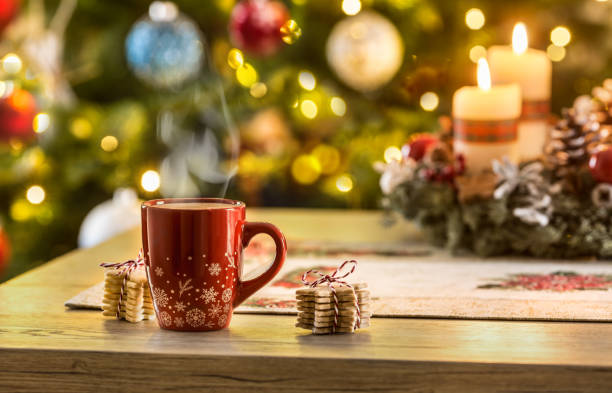 istock Christmas coffee and advent wreath on table with boheh lights in background 1194634986