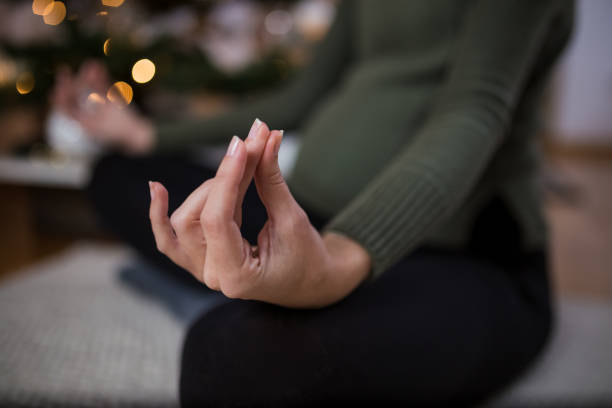 istock Practicing yoga during pregnancy. Christmas holiday and exercising concepts. 1194635555