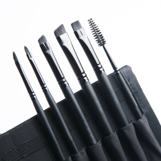 istock Set of black eyebrow brushes. Leather case with makeup brushes. 1194637807