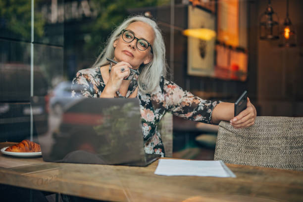 istock Lady author sitting in cafe alone 1194639144