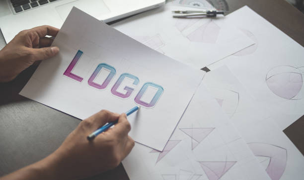 istock Graphic designer creative design sketch drawing logo Trademark brand Workspace 1194641538