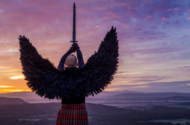 istock Black Winged Warrior Angel at dawn 1194641832