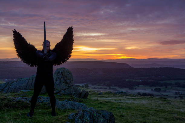 istock Black Winged Warrior Angel at dawn 1194642016